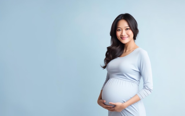 happy pregnant asian woman touching her belly