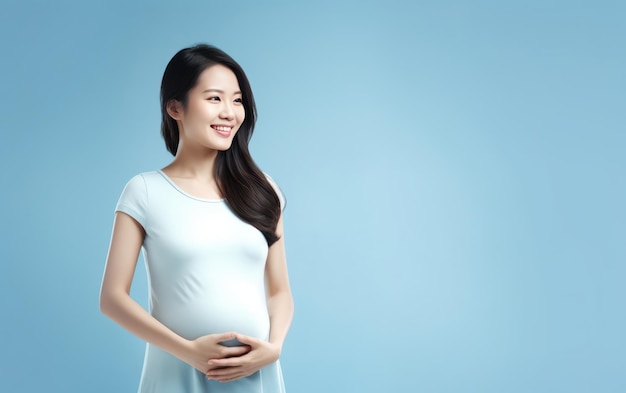 happy pregnant asian woman touching her belly