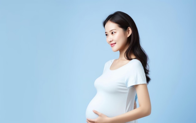 happy pregnant asian woman touching her belly