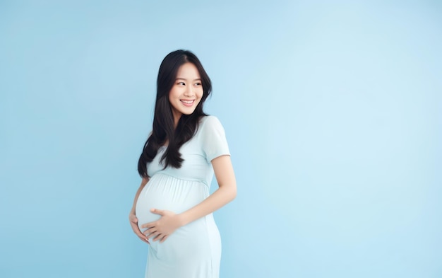 happy pregnant asian woman touching her belly