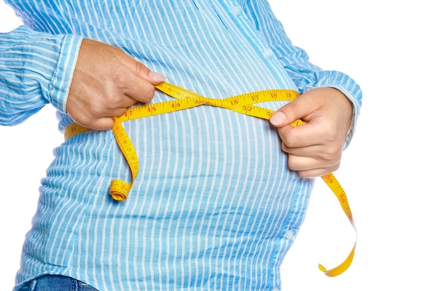 Happy pregnant girl lies on white background