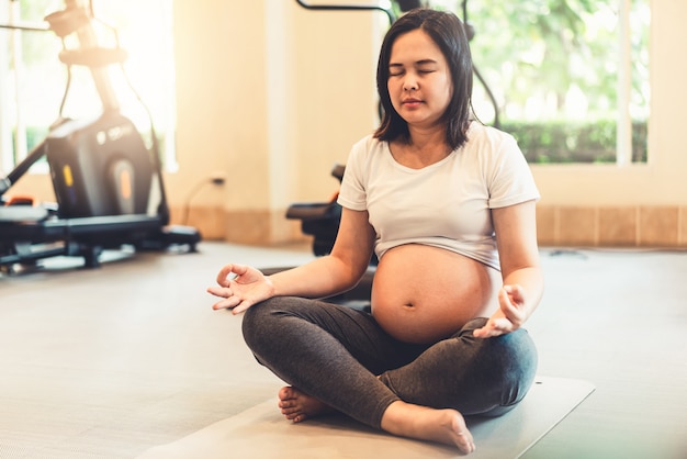 Happy pregnant woman and expecting baby.