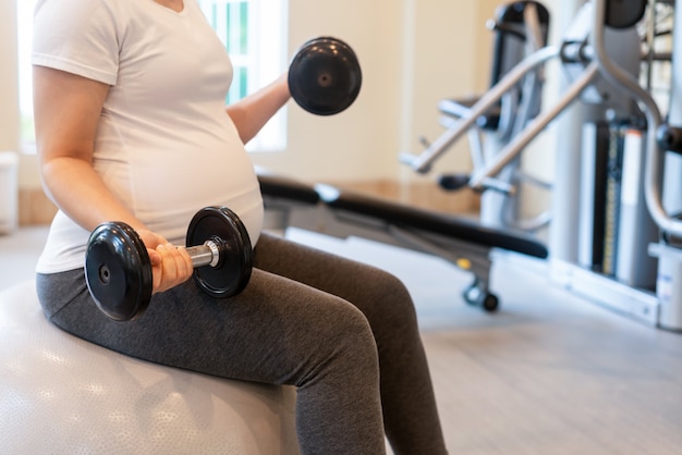 Happy pregnant woman and expecting baby.