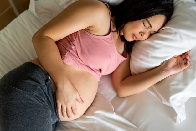 Happy pregnant woman and expecting baby.