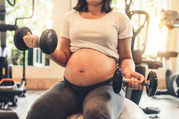 Happy pregnant woman and expecting baby.