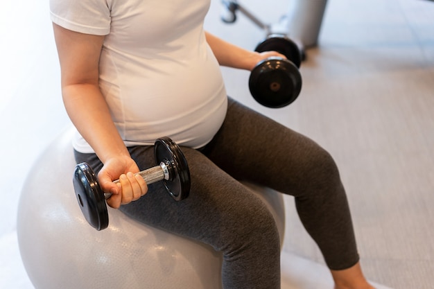 Happy pregnant woman with baby in pregnant belly. 