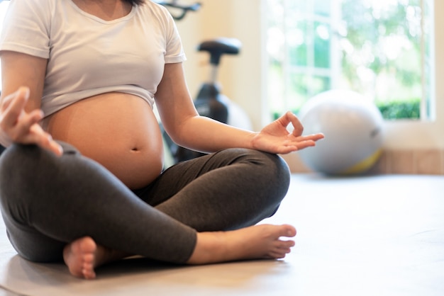 Happy pregnant woman with baby in pregnant belly. 