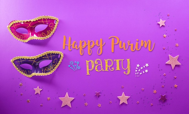 Happy Purim carnival decoration concept made from mask and sparkle star on purple background Happy Purim in Hebrew jewish holiday celebrate