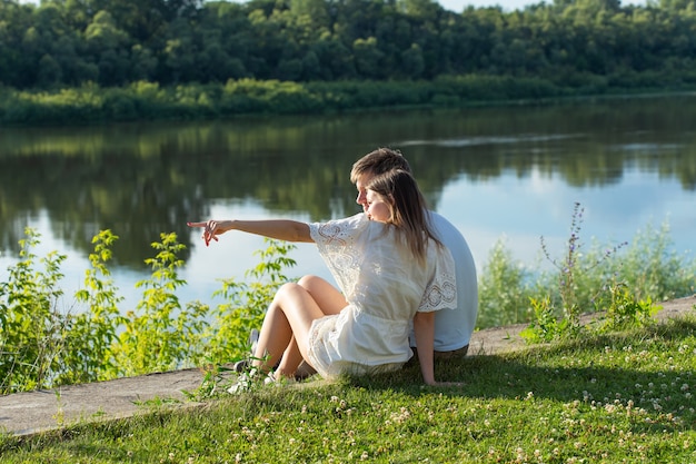 Happy romantic couple in love and having fun outdoor in summer day, beauty of nature, harmony concept.