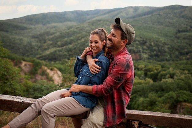 Happy and romantic couple traveling together in nature