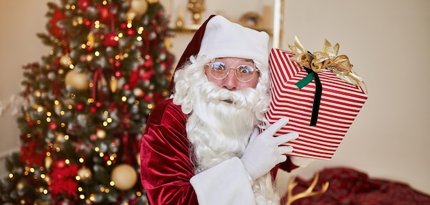 Happy santa claus brought gifts to children new year and merry christmas holidays concept