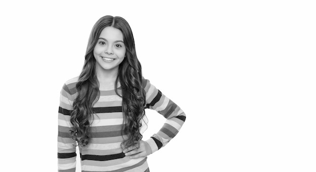 Happy schoolaged female child smile in striped sweater isolated on white girl