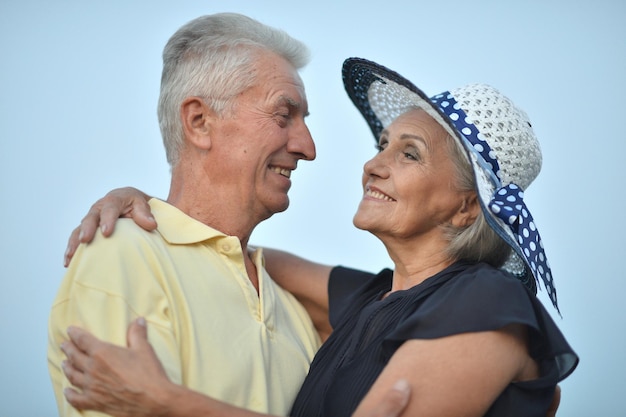 Happy senior couple embracing outdoors