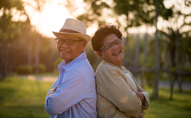 A happy senior couple smiling and laughing in the garden happy marriage