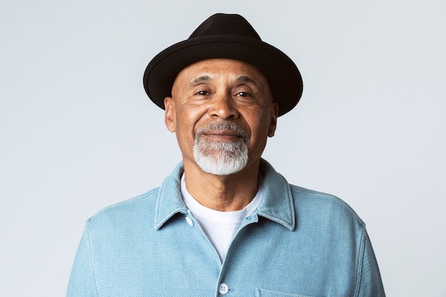 Happy senior man wearing a black hat