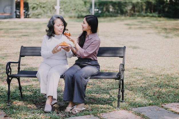 Happy senior woman enjoying in daughter's affection on Mother's day