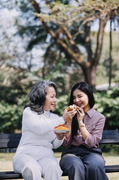 Happy senior woman enjoying in daughter's affection on Mother's day