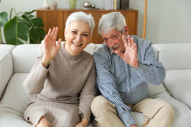 Happy senior woman man talk on video call with friends family mature old grandmother grandfather tal