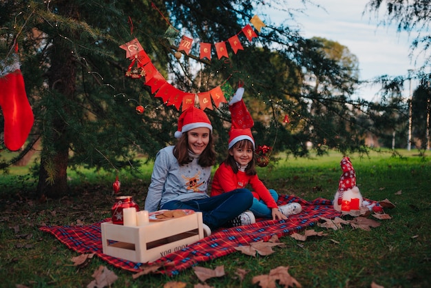 Happy sisters taking some Christmas photos