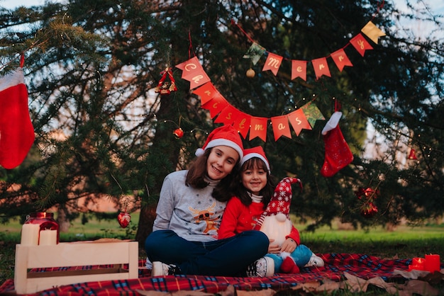 Happy sisters taking some Christmas photos