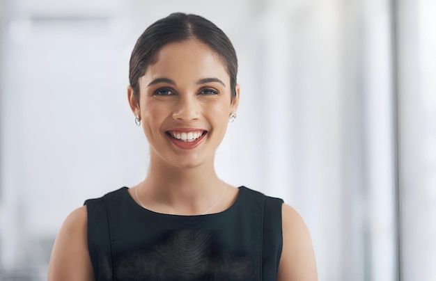 Happy smile and portrait of business woman in the office with positive good and confident attitude