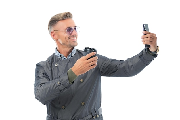 Happy smiling business man businessman ceo in formal coat taking selfie on business smartphone