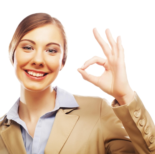 Happy smiling business woman with okay gesture