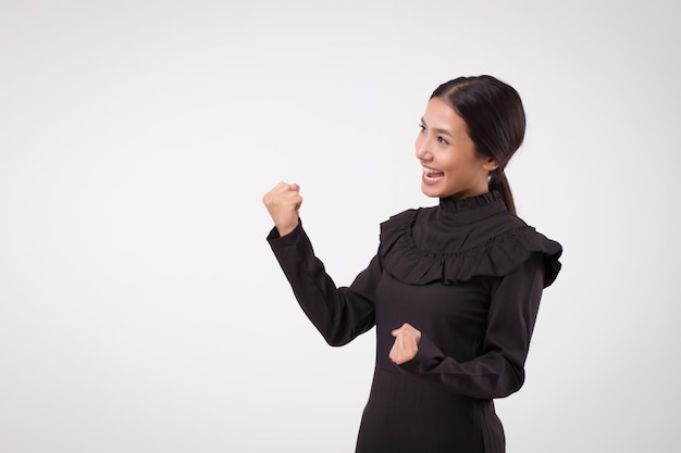 Happy smiling excited woman portrait looking; surprised laughing happy woman, smiling girl looking studio isolated; woman looks up, smiles with happy joyful cheerful face expression; asian woman model