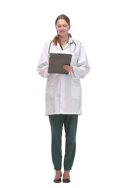 Happy smiling female doctor with stethoscope writing on clipboard