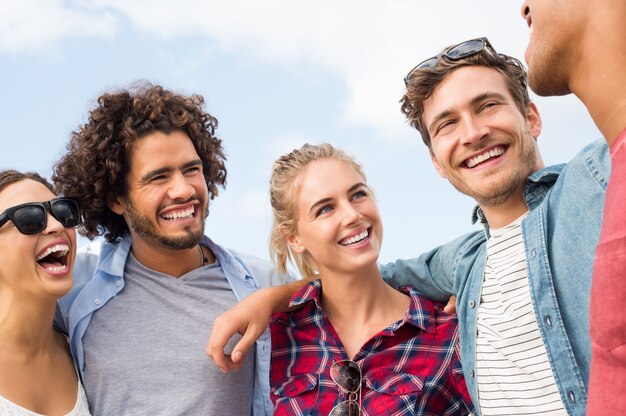 Happy smiling friends having fun together outdoor