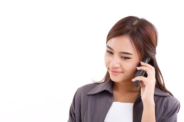 Happy smiling positive business woman talking communicating via her smartphone