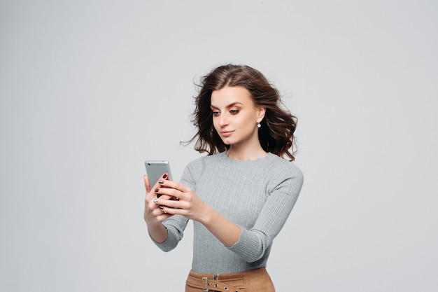 Happy smiling woman with modern smartphone