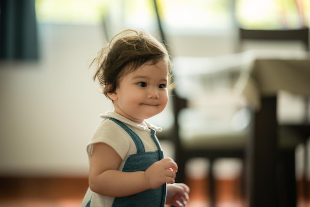 Happy son child baby playing at home by supporting with family father and mother