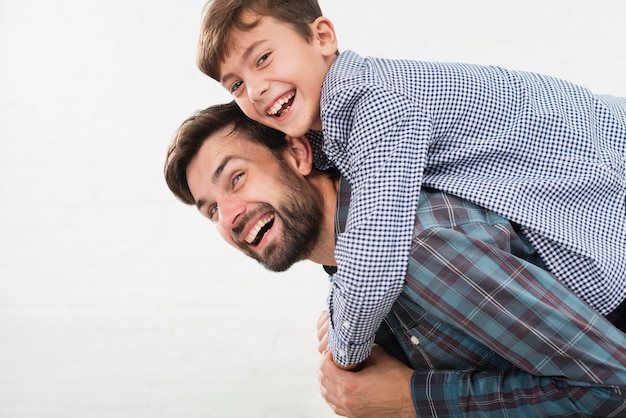 Happy son embracing his father