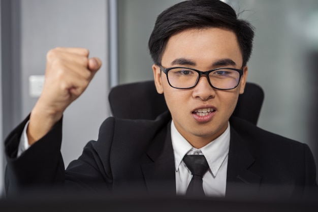 happy successful business man using laptop computer