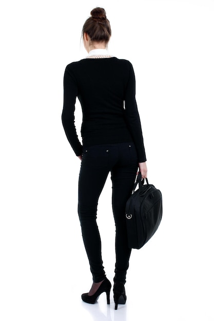 Happy successful business woman in black suit with bag