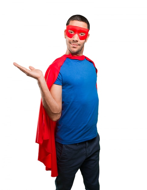 Happy superhero with show gesture