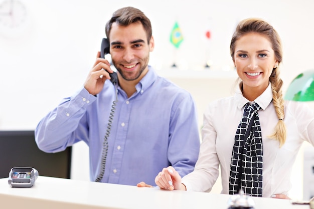 happy team of hotel receptionists