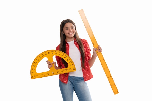 Happy teen girl hold protractor ruler measuring size and angle degree at school isolated on white education