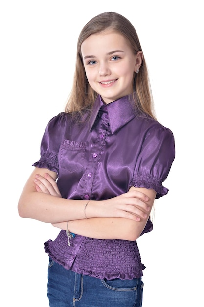 Happy teen girl in purple blouse posing on white background