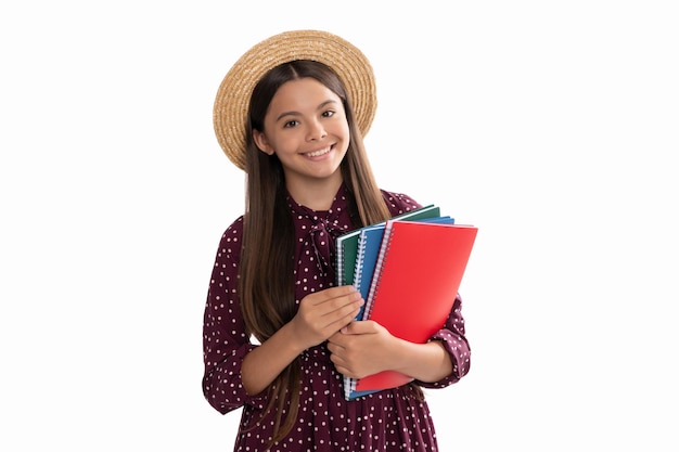 Happy teen girl with notebook back to school child in straw hat ready to study childhood development kid going to do homework teenager student high school education schoolgirl with copybook