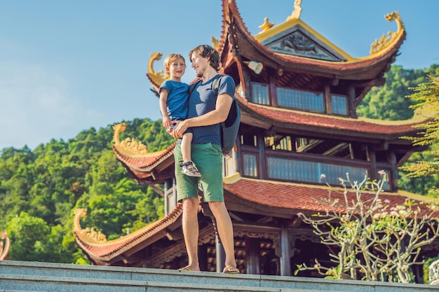 Happy tourists dad and son in Pagoda. Travel to Asia concept. Traveling with a baby concept