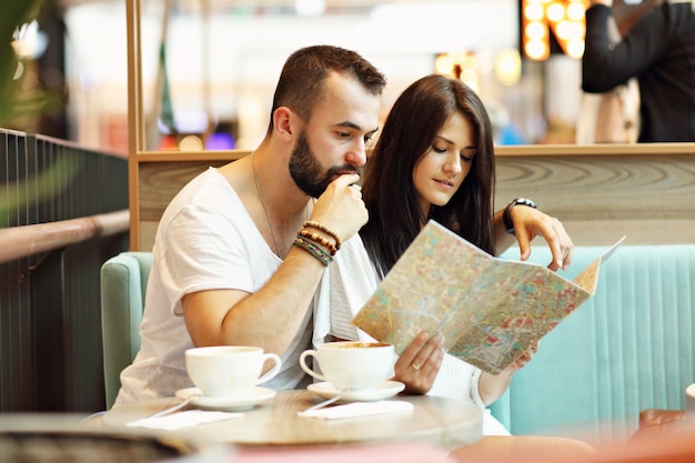 happy tourists having a break in cafe