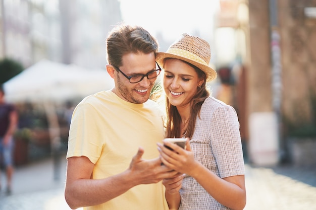 happy tourists sightseeing during summer holidays