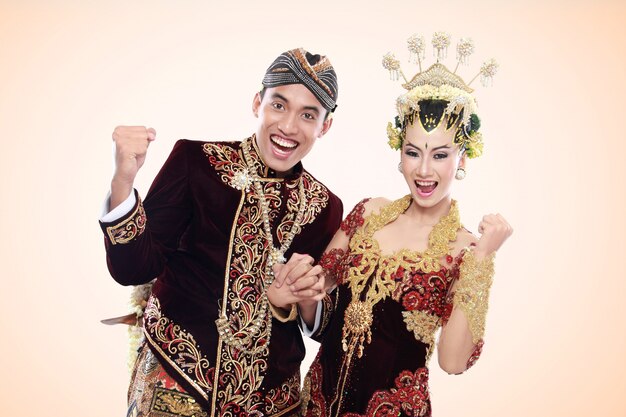 Happy traditional java wedding couple