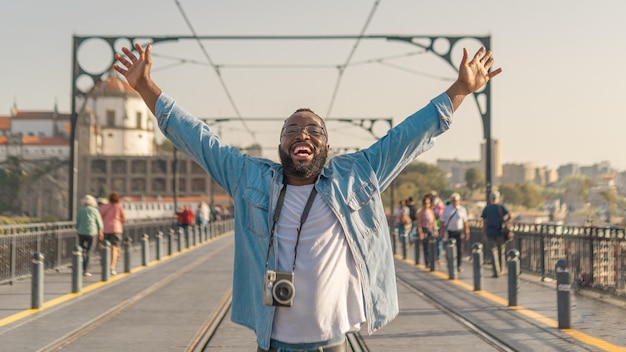 Happy Traveller man on the Oporto bridge