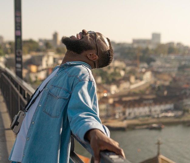 Happy Traveller man on the Oporto bridge