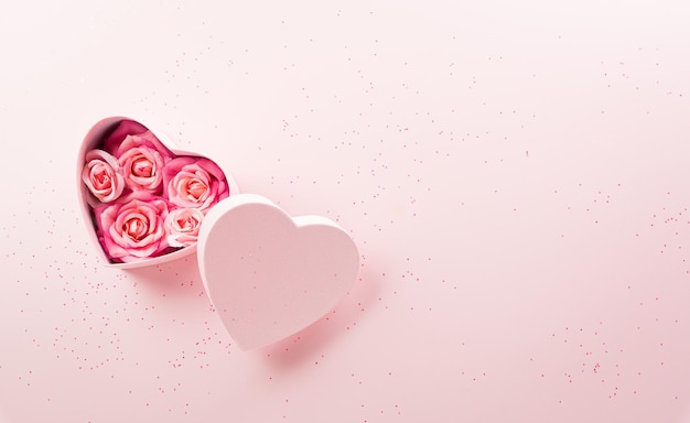 Happy valentine's day and love decoration background concept made from hearts and rose on pastel pink background