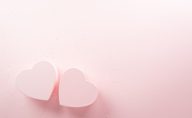 Happy valentine's day and love decoration background concept made from two hearts on pastel pink background