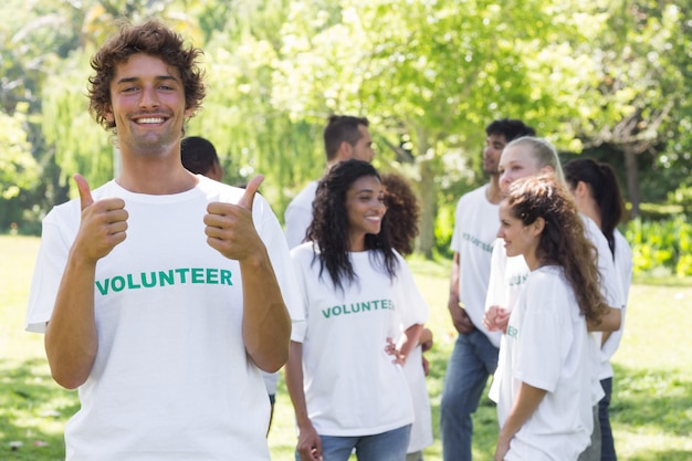 Happy volunteer gesturing thumbs up 